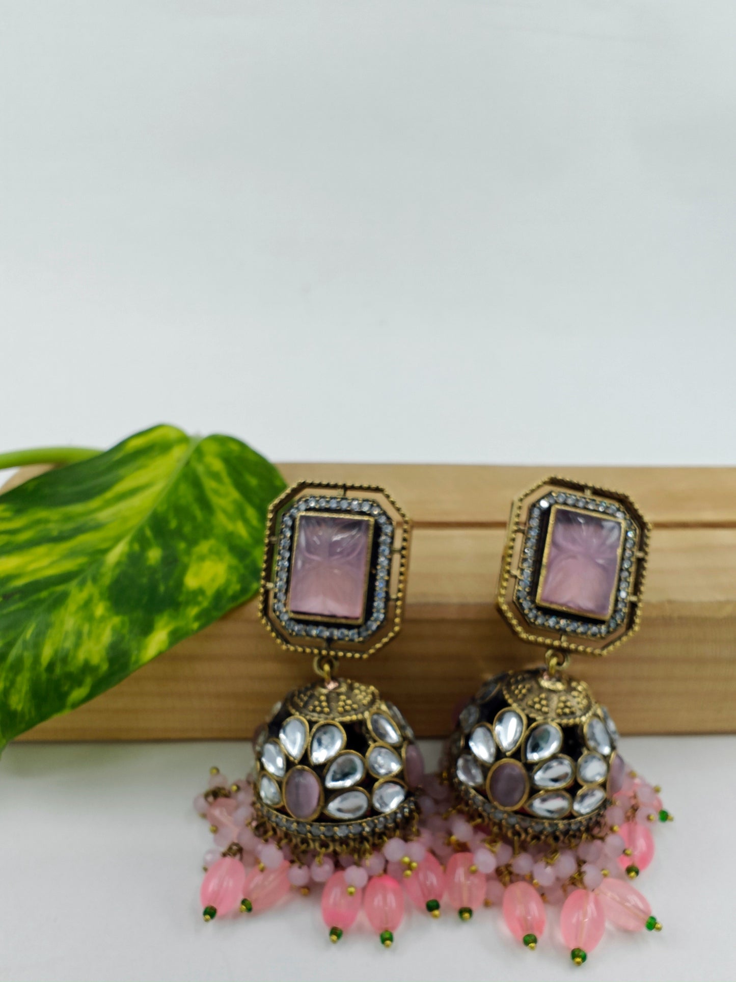 Jhumkas( earrings) in antique finish with kundan and coloured stone