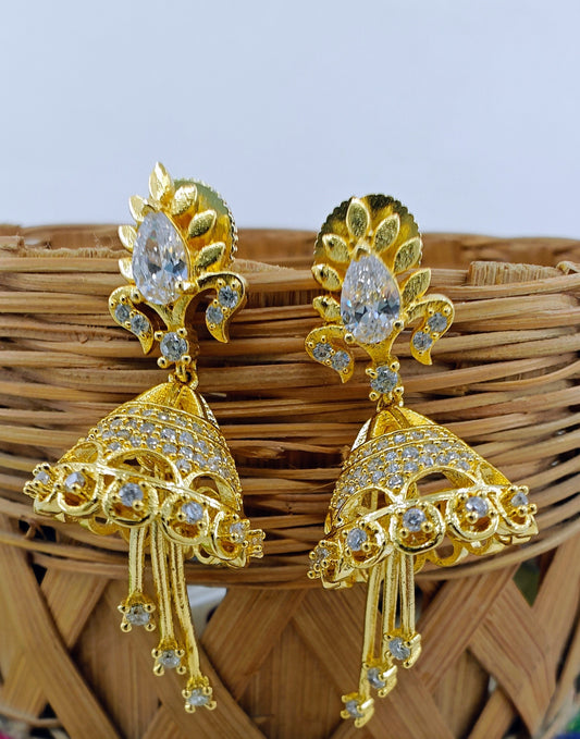 Delicate golden Jhumkis( earrings) with pink stone/clear stone