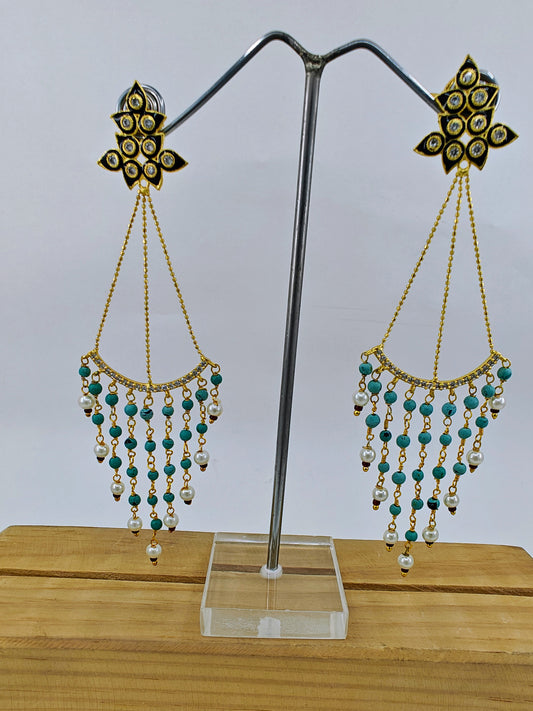 Earrings in gold finish, delicate long danglers with black meenakari and stone hangings