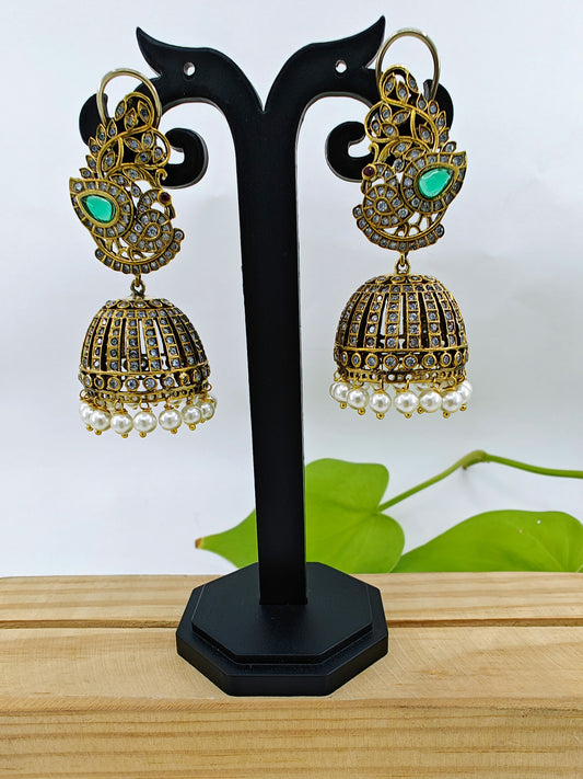 Antique jhumkis(earrings) with pearl hangings and peacock design on stud with green stone