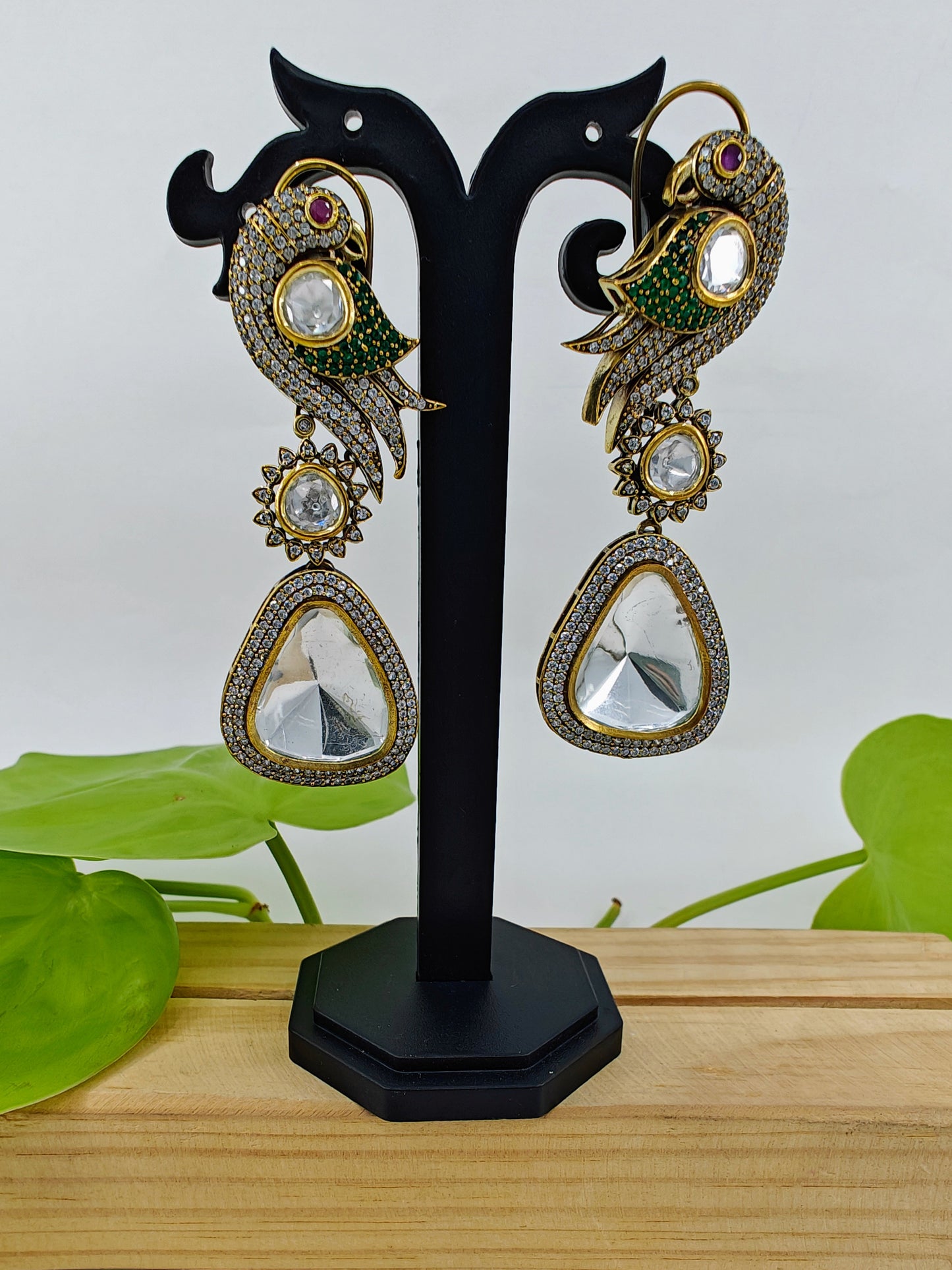 Kundan earrings in antique finish with a parrot on the stud and a big kundan hanging stone