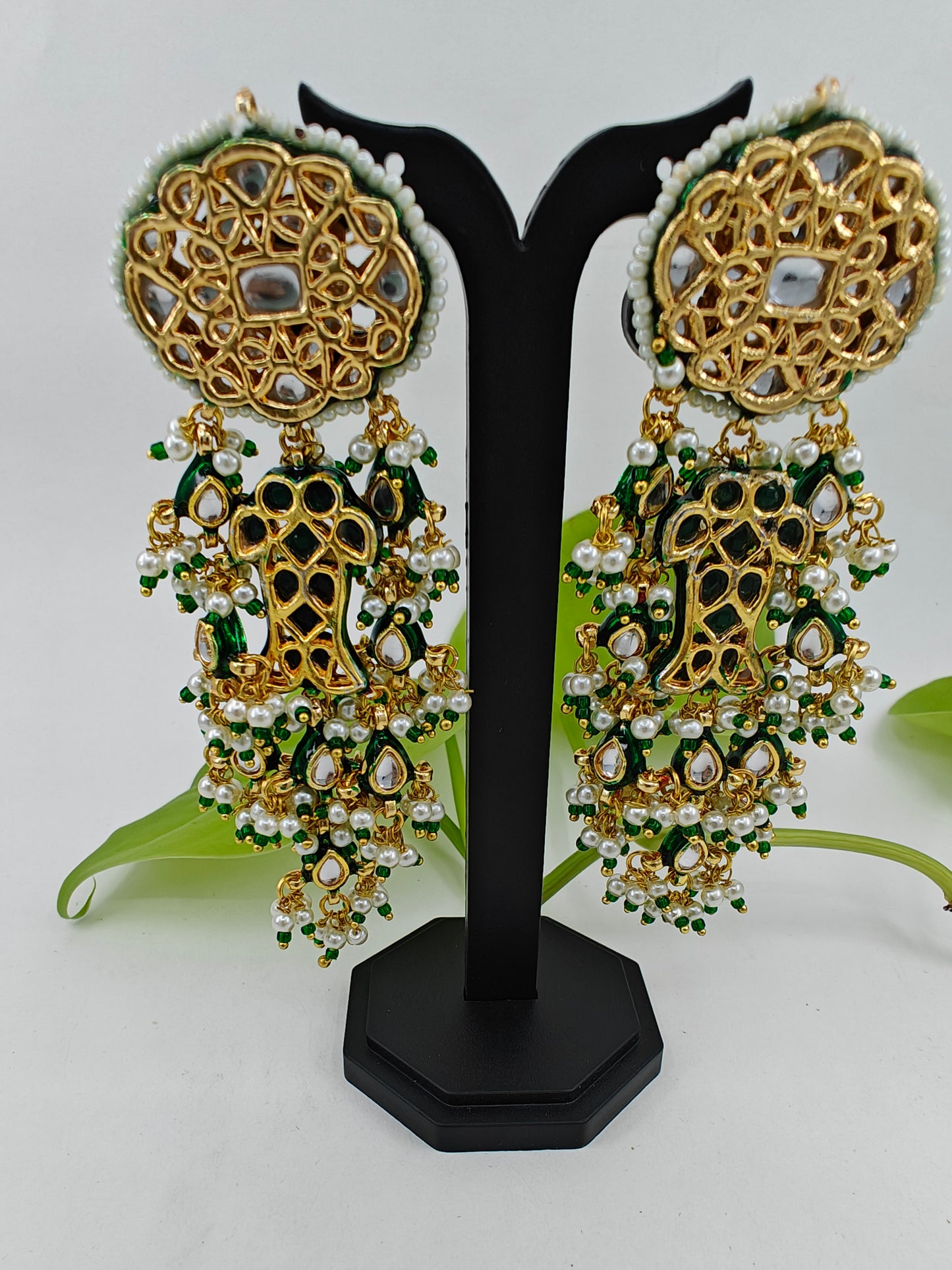 Long golden earrings in Kundan and pearl and bead hangings