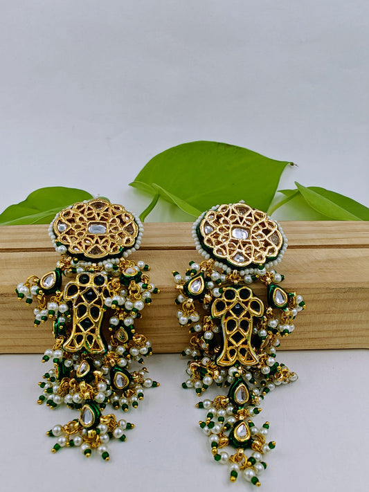 Long golden earrings in Kundan and pearl and bead hangings