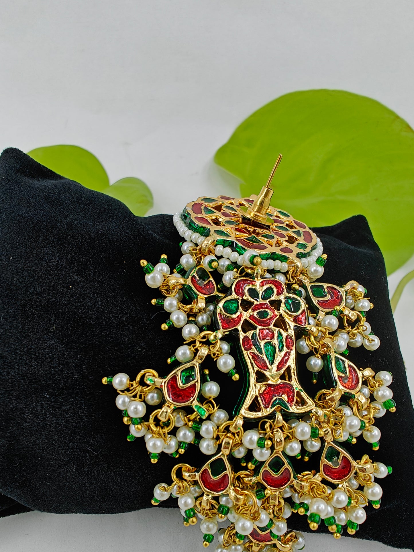 Long golden earrings in Kundan and pearl and bead hangings