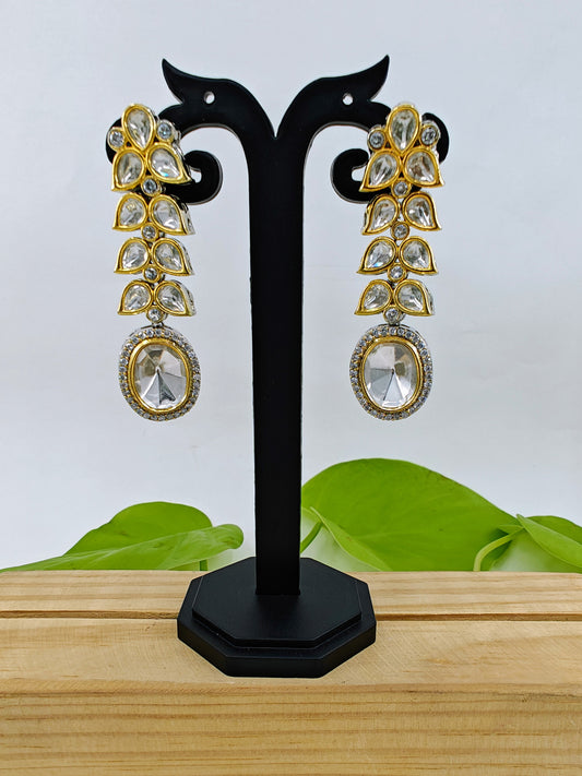 Long Kundan earrings with oval kundan hanging on kundan leaf twig