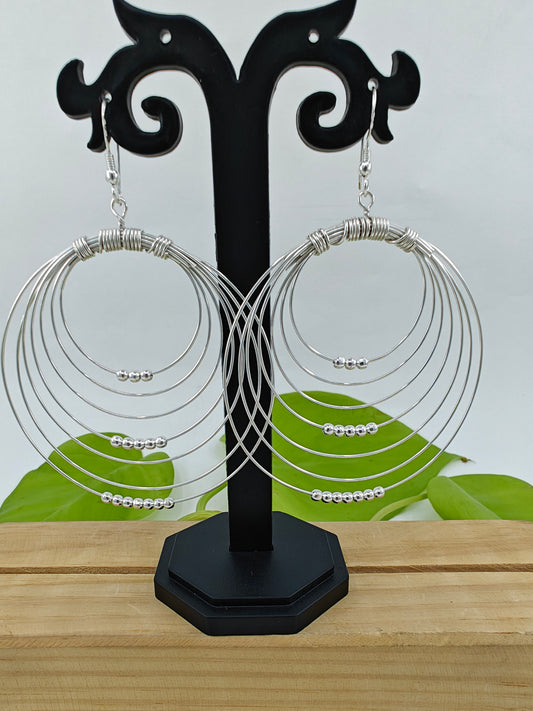 Silver danglers (earrings) with concentric circles wires with beads