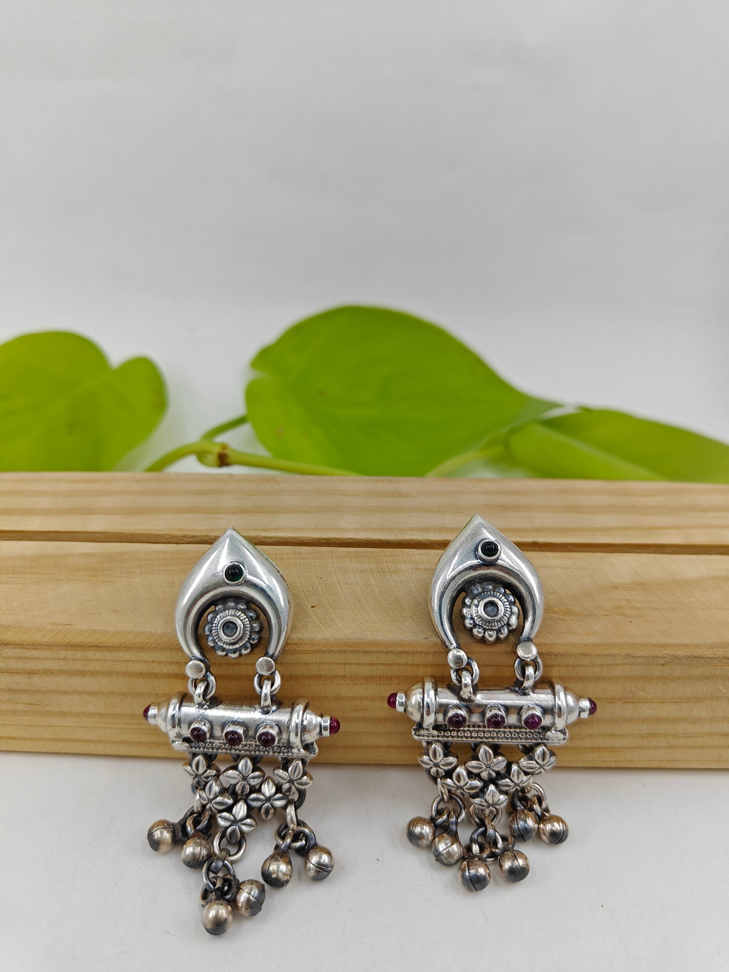 Silver earrings with a chattai and ghungroo hangings