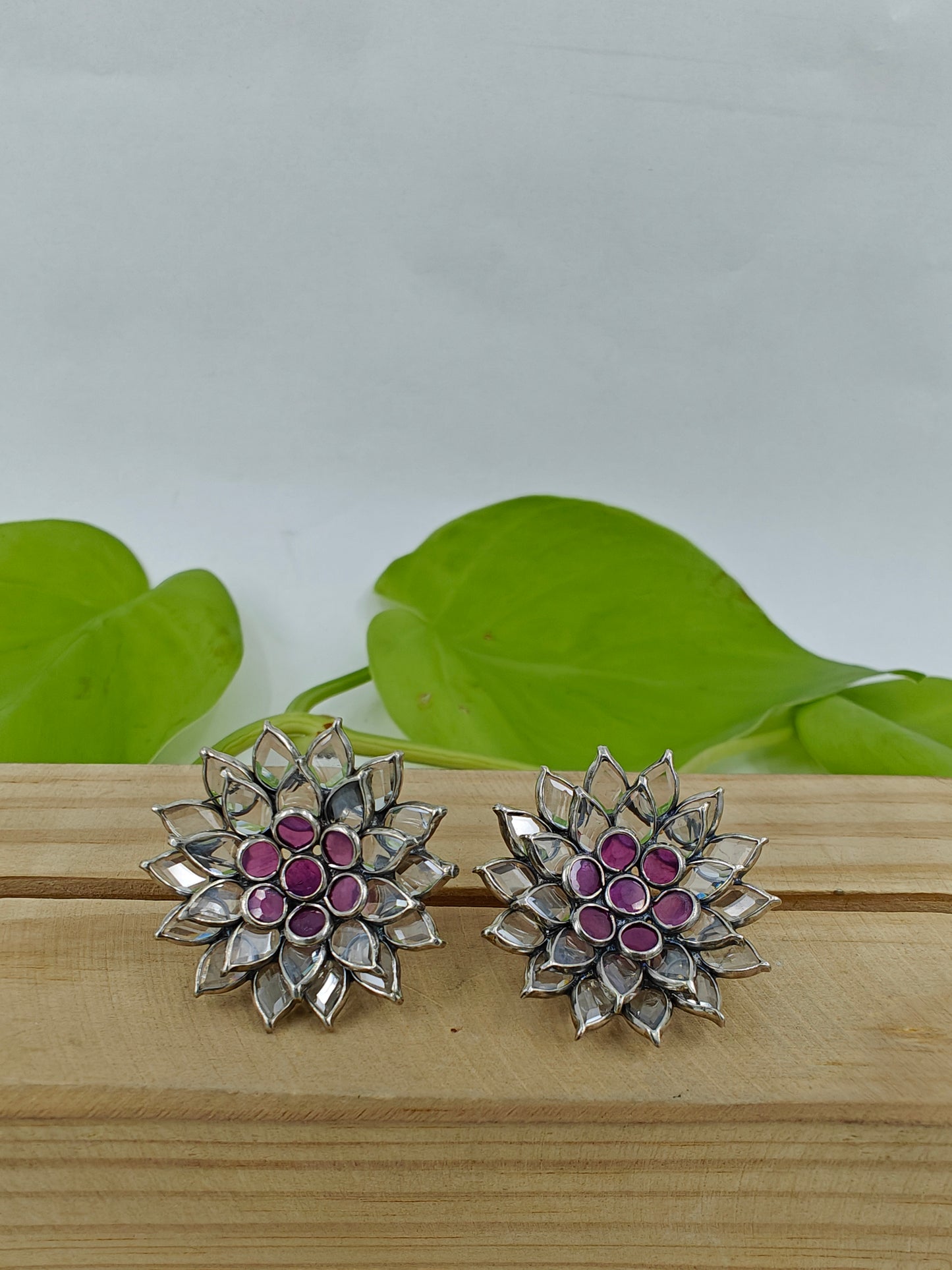 Silver stud (earrings) with open flower design with pink and clear stones