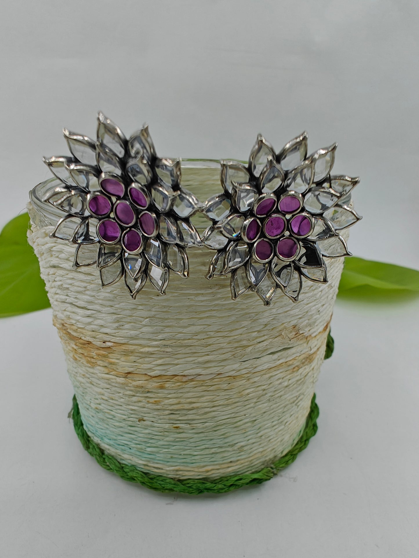 Silver stud (earrings) with open flower design with pink and clear stones