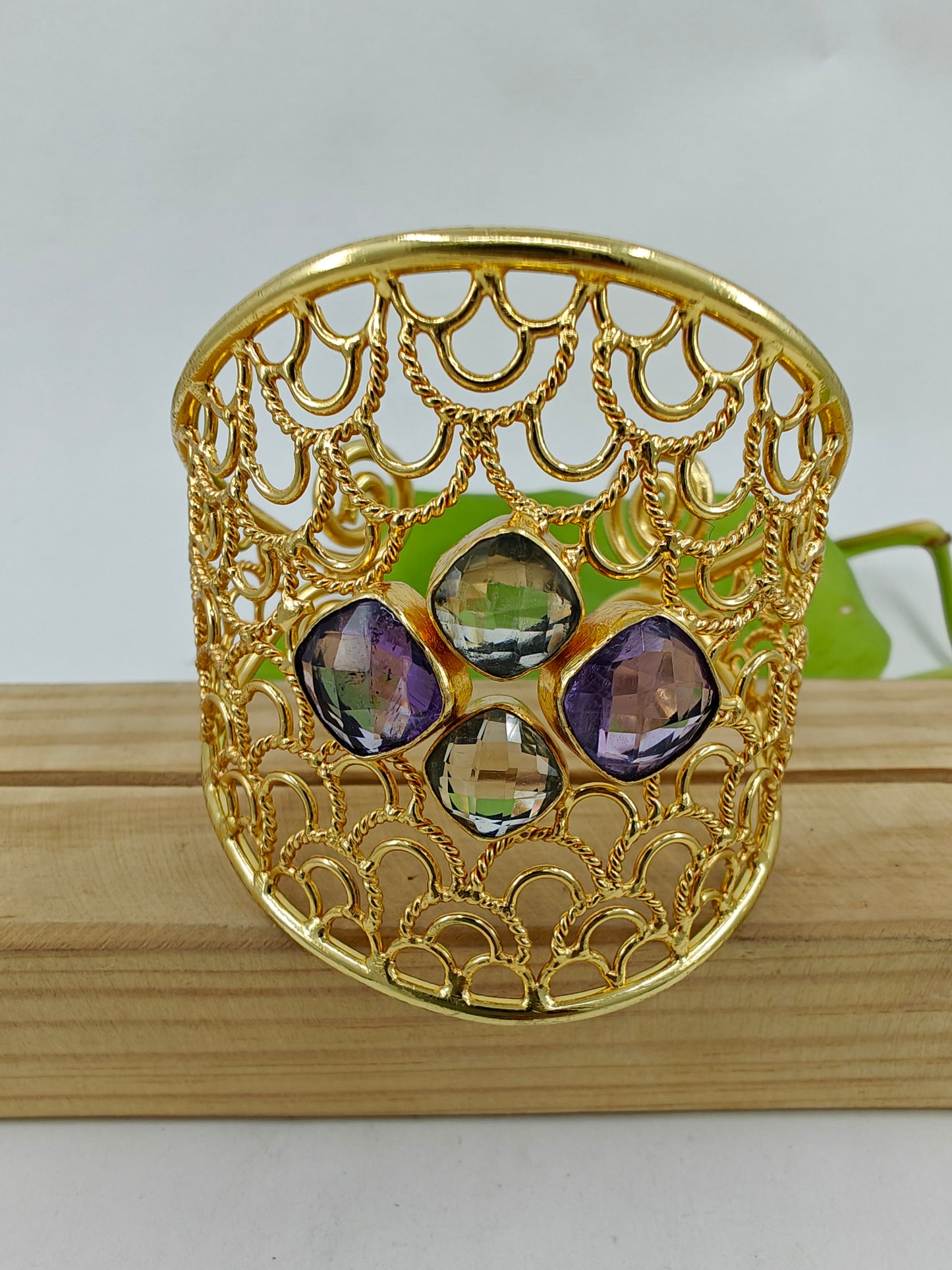 Kuff/ Bangle in gold finish with jali work and stones in centre