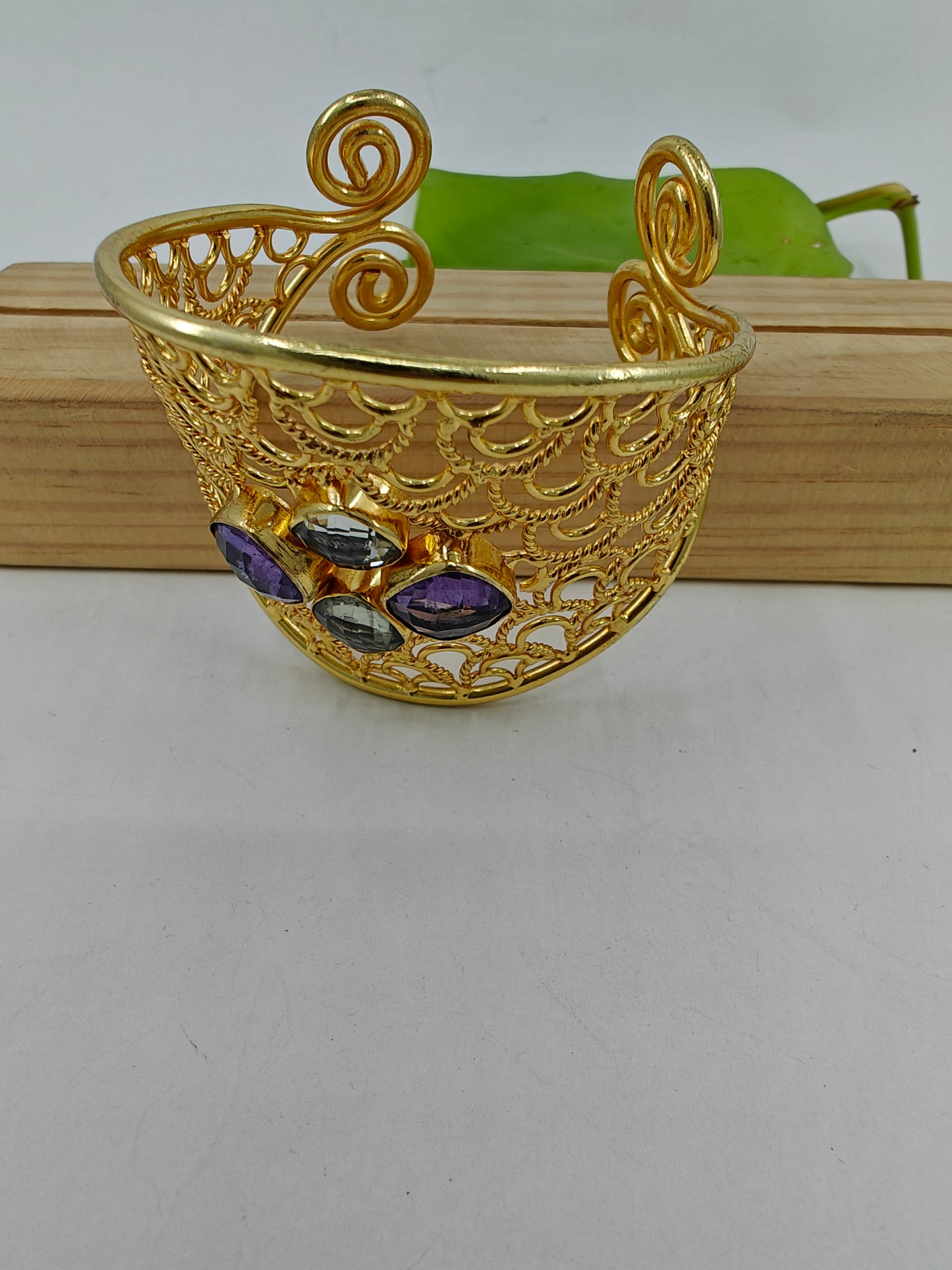 Kuff/ Bangle in gold finish with jali work and stones in centre