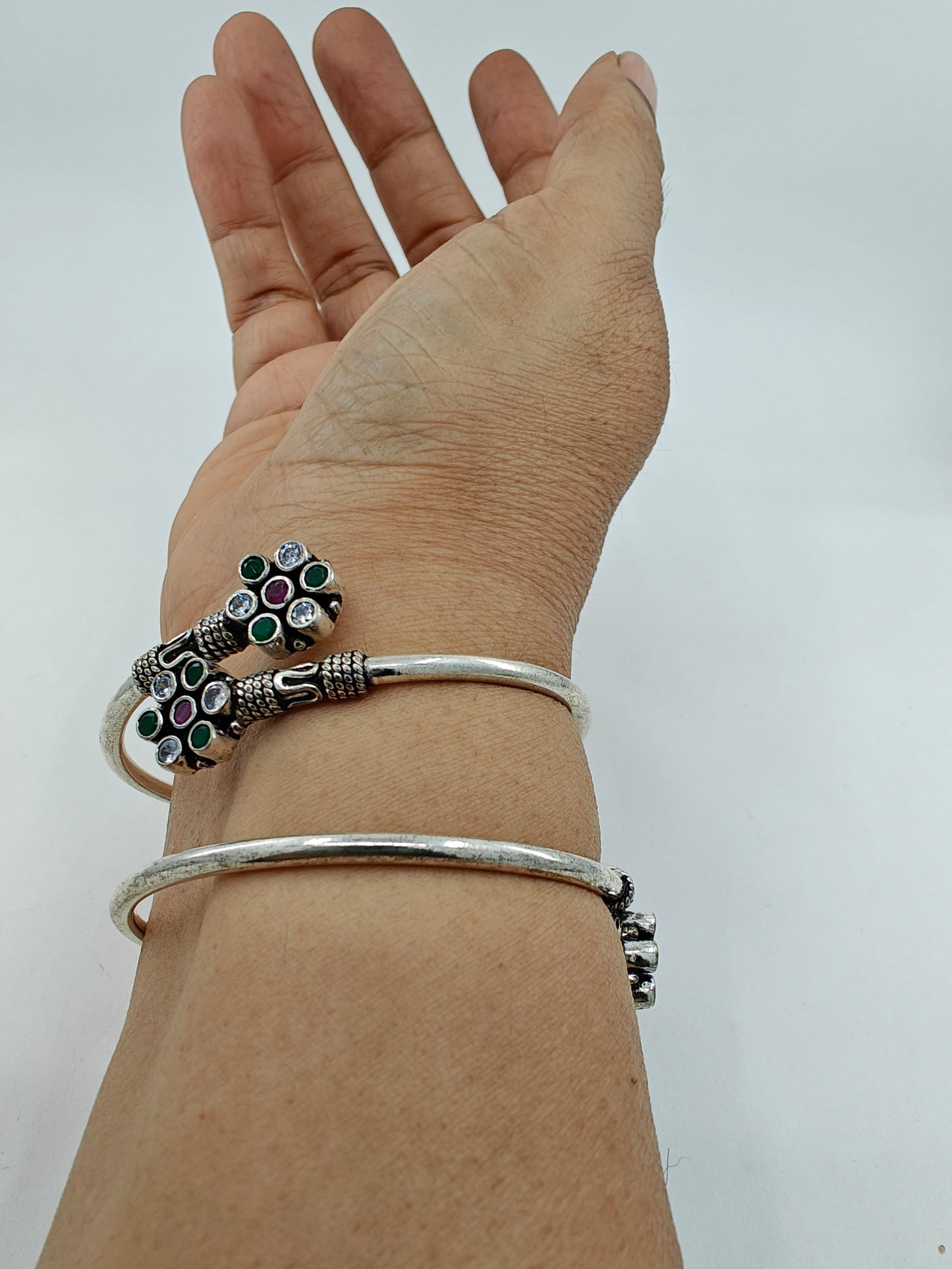 Silver pipe bangles with green,clear stone and pink stone in flower design(2pcs)