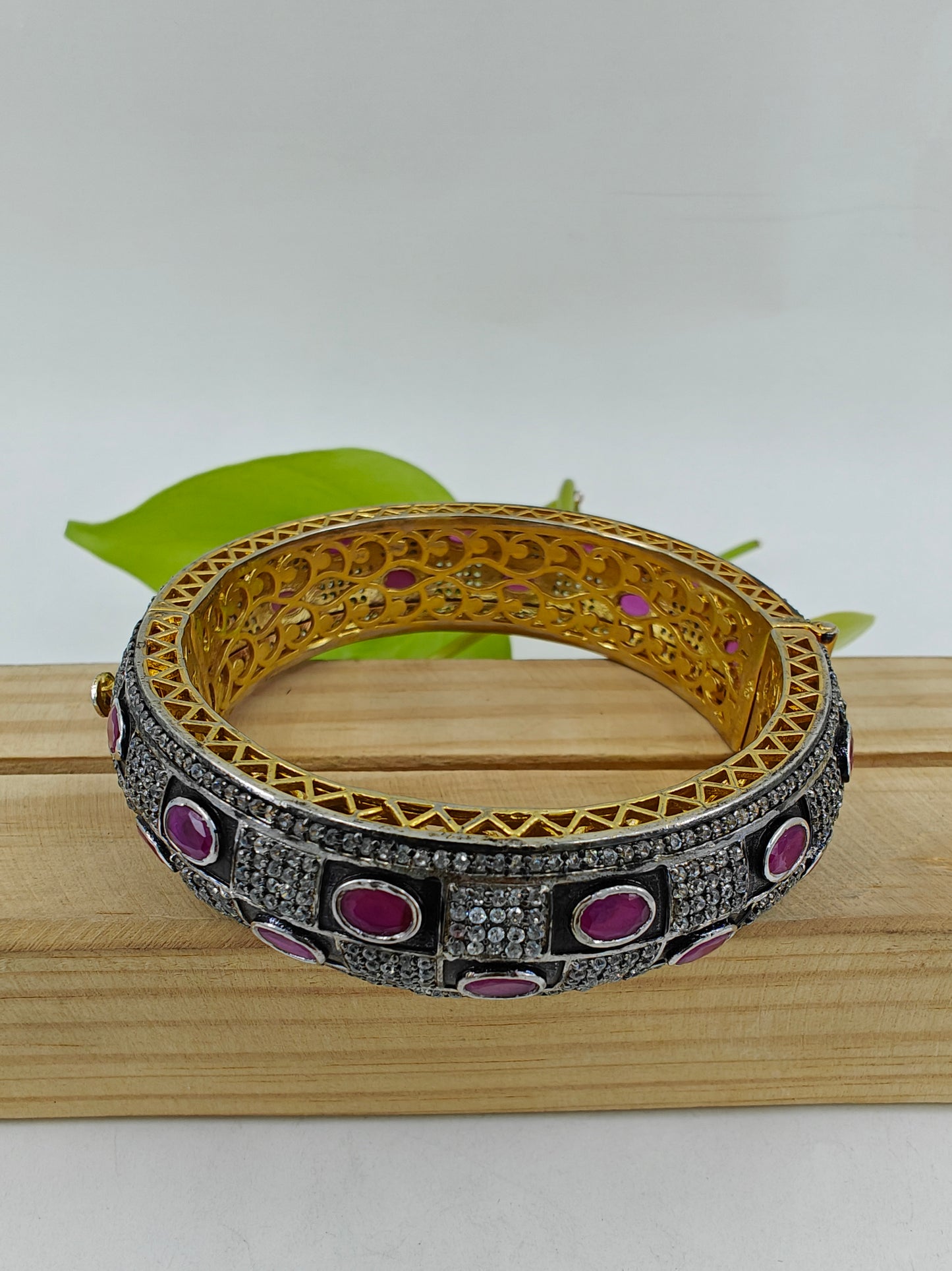 Kara(bangle)with check design in black with red/blue stones and CZ