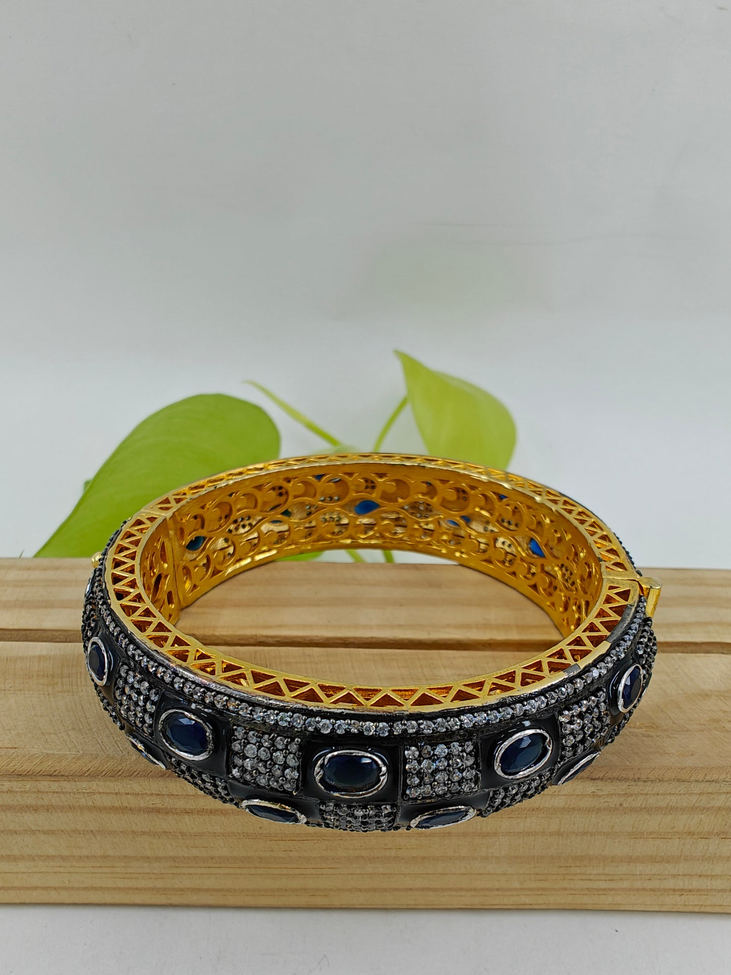 Kara(bangle)with check design in black with red/blue stones and CZ