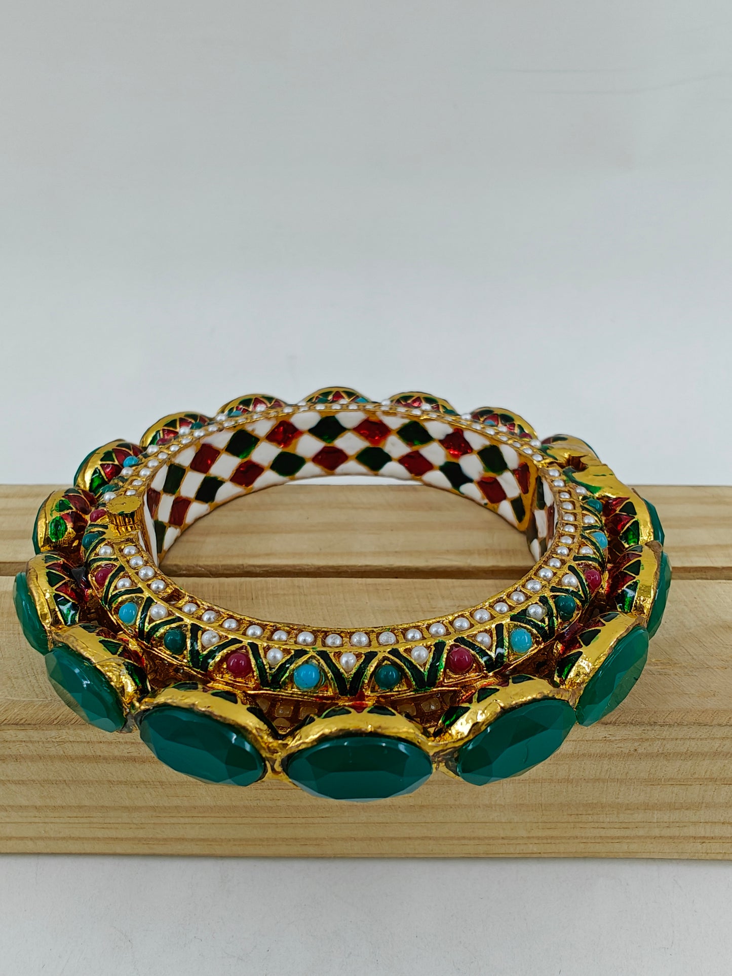 Kara( bangle) with jadau multicolour stones and green/green and red stones on top