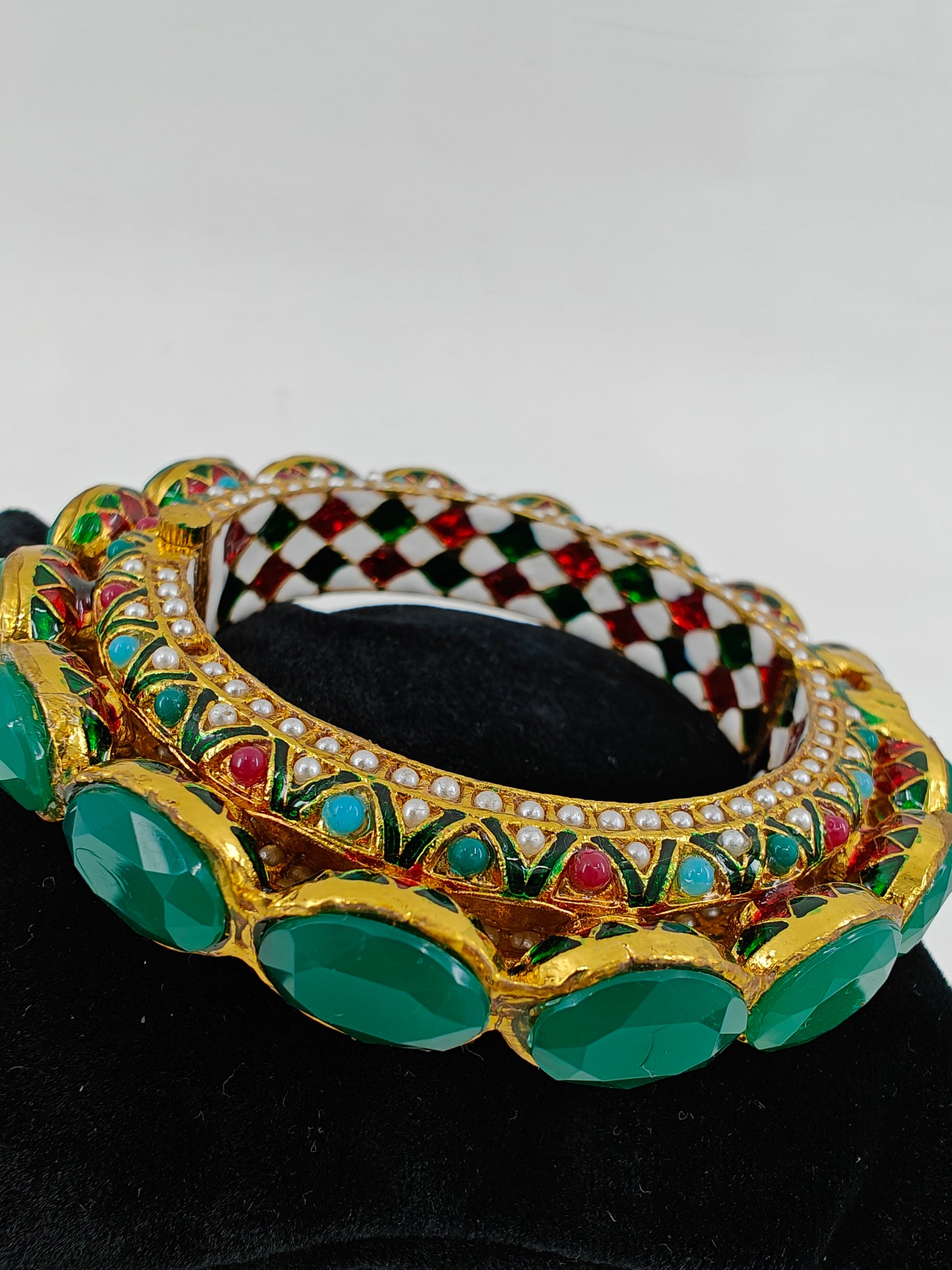 Kara( bangle) with jadau multicolour stones and green/green and red stones on top