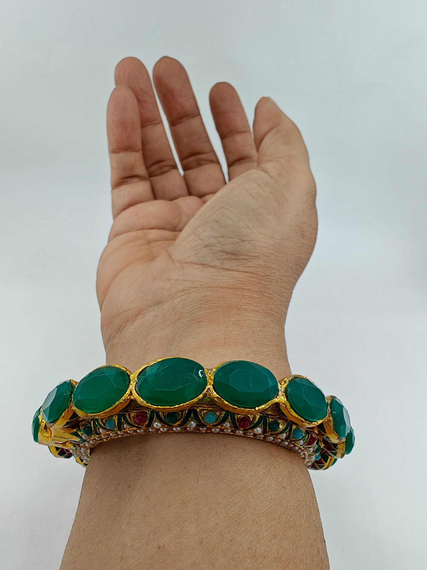 Kara( bangle) with jadau multicolour stones and green/green and red stones on top