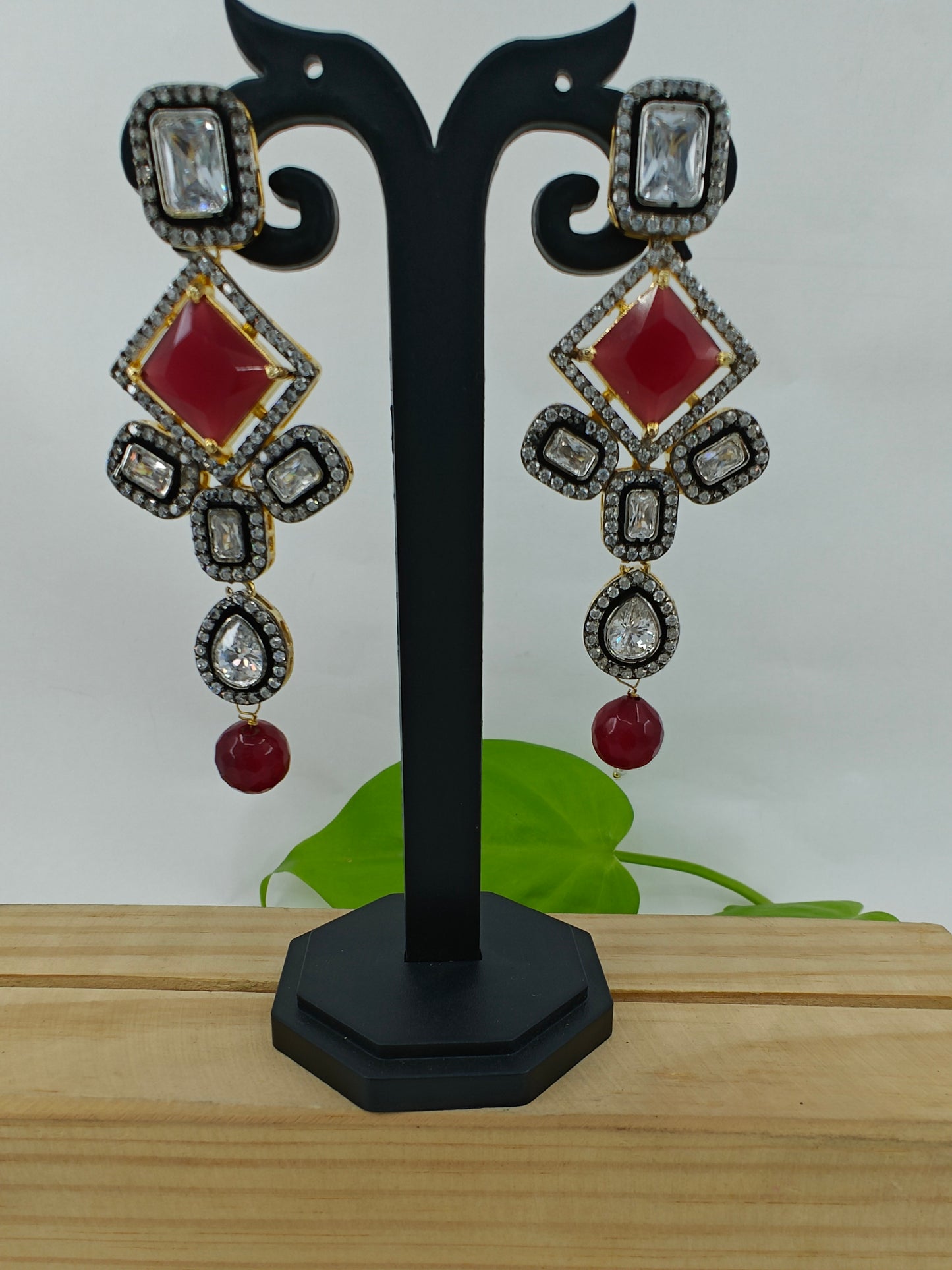 Set in antique finish,Pendant with CZ and red stone on red garnet strands,long earrings