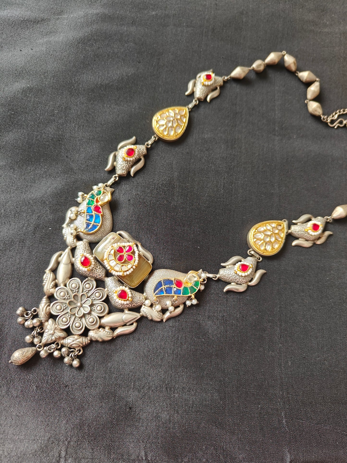 Big necklace in antique Silver finish with stone work in blue,green,red and poth pearls on top of pieces