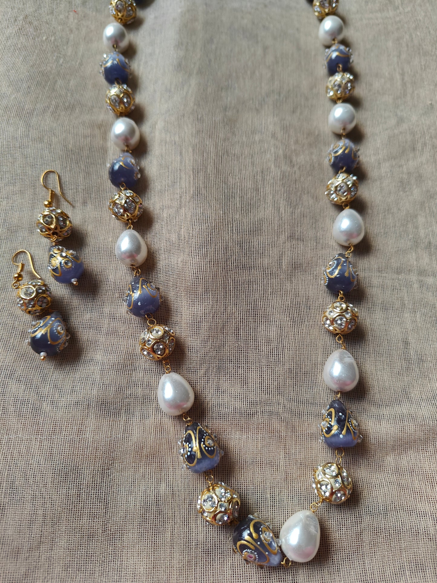 Set with baraque pearls,worked upon beads , matching earrings