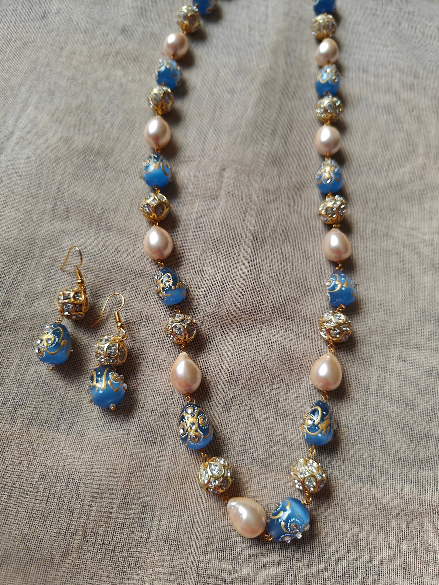 Set with baraque pearls,worked upon beads , matching earrings