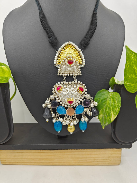 Tilism necklace in black thread with a dual tone pendant with multicolour big stones,kundan,pearl work and ghungroo