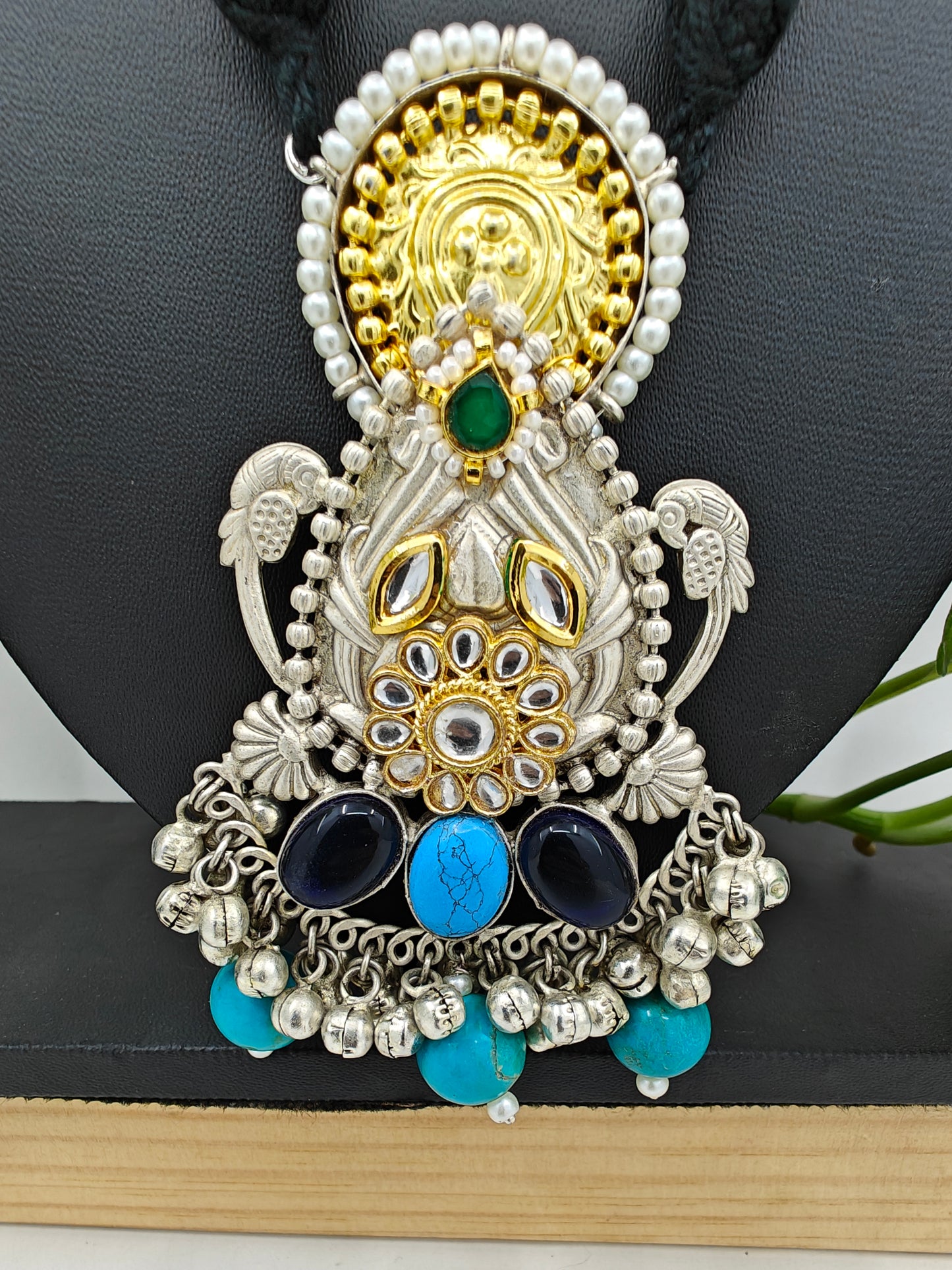 Tilism necklace in black thread with a dual tone pendant with multicolour big stones,kundan,pearl work and ghungroo