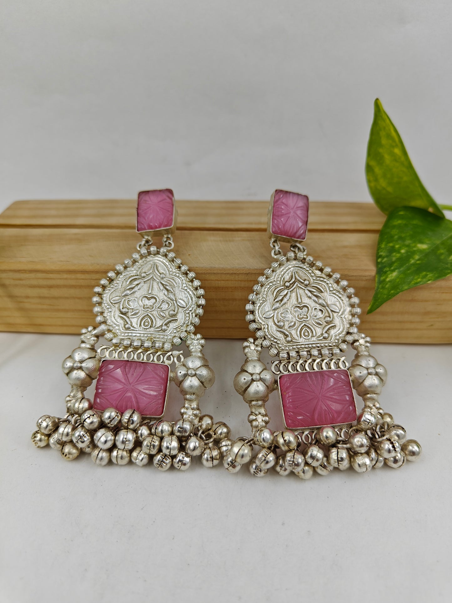 Big earrings with carvings,pink stone and ghungroos