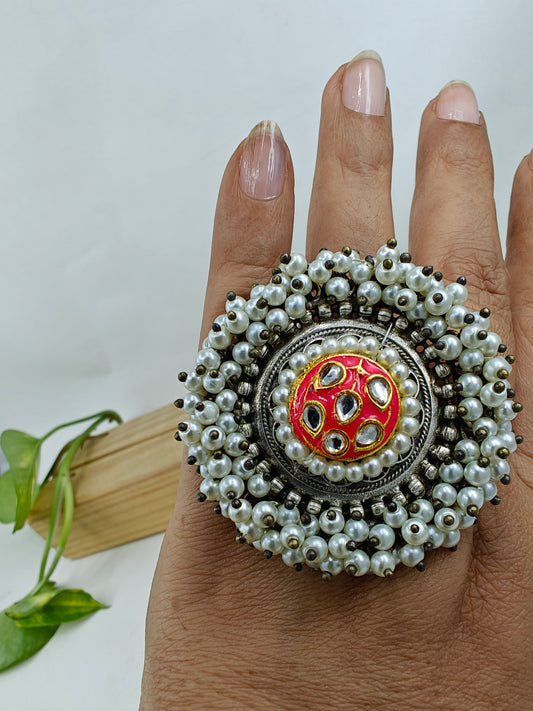 Ring with kundan and meenakari work in centre,pearl beads surrounding it