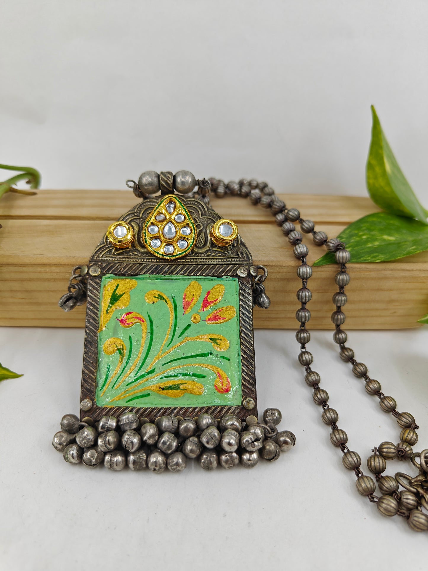 Bead necklace in antique silver finish with mint green painted with kundan work