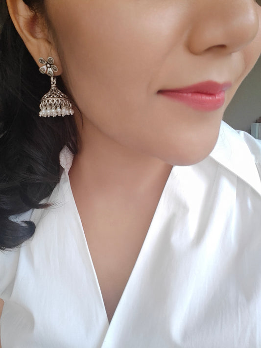 Silver jali jhumkis (earrings) on an open flower stud,pearl hangings