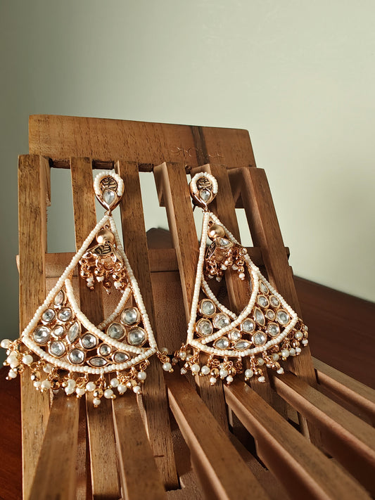 Poth pearl and Kundan triangular hanging earrings.