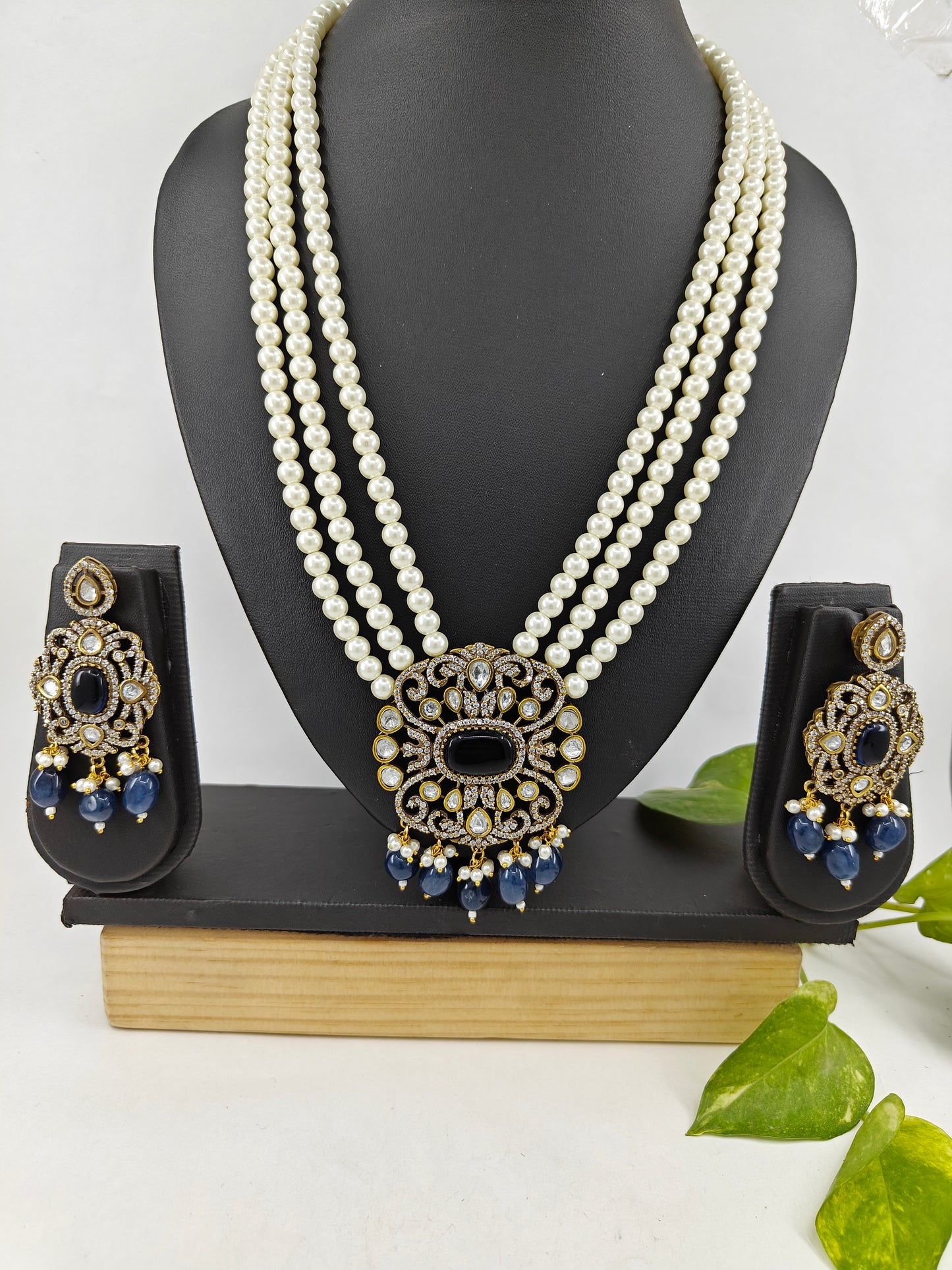 Antique necklace and earrings set with tripple pearl strands and blue drops