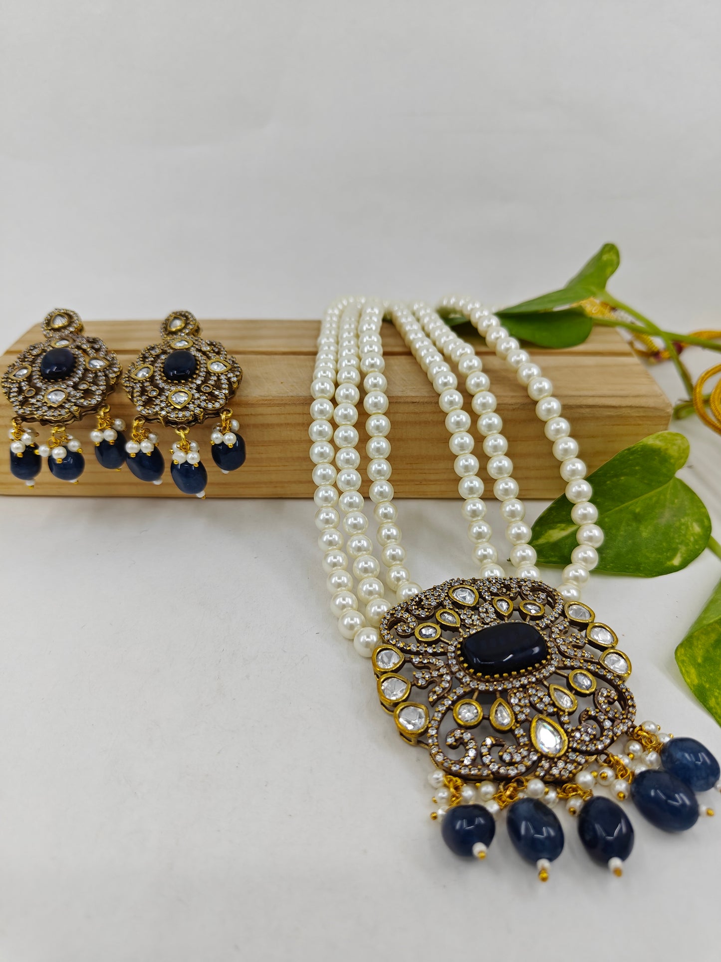 Antique necklace and earrings set with tripple pearl strands and blue drops