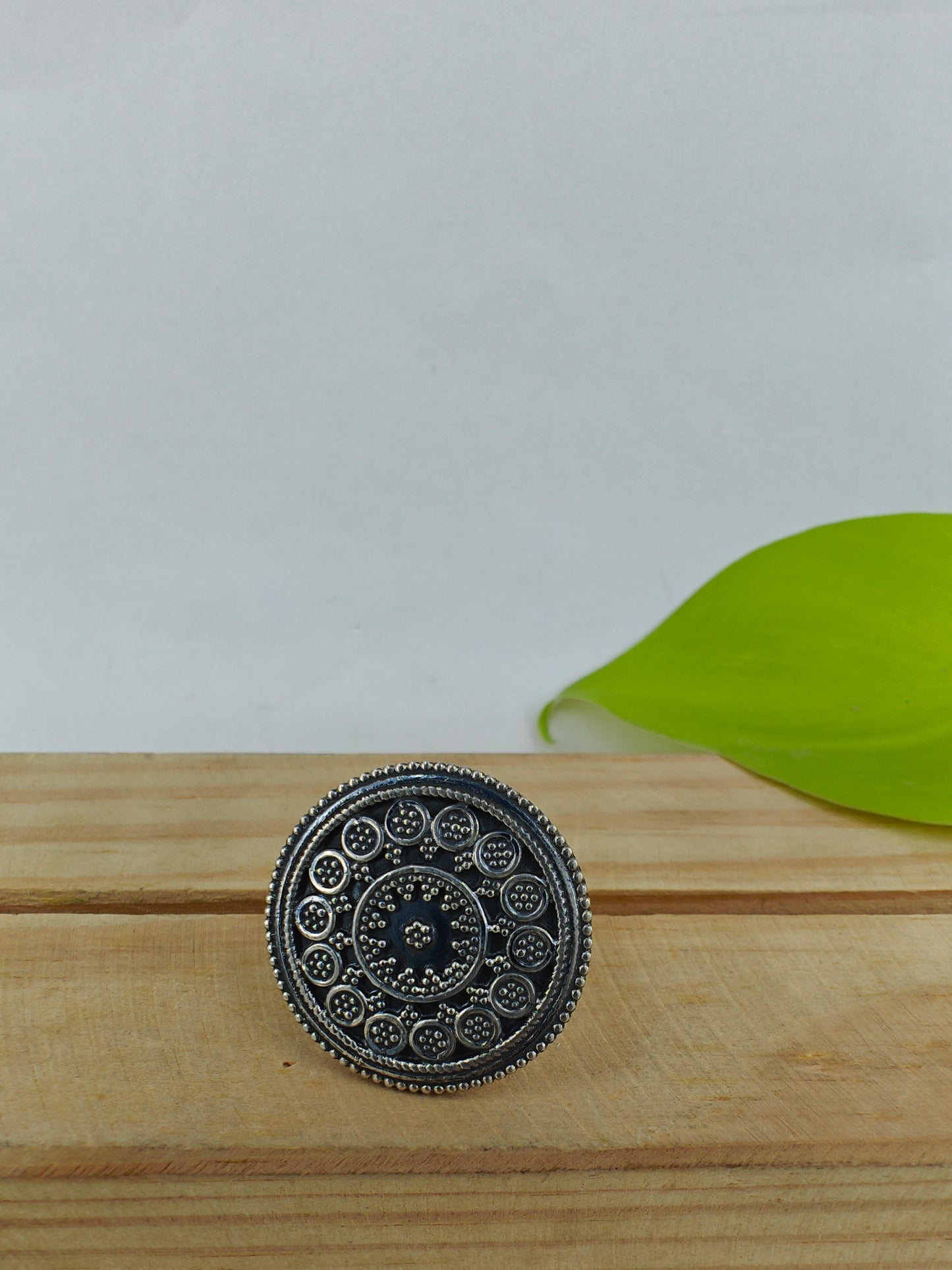 Round silver ring with carvings