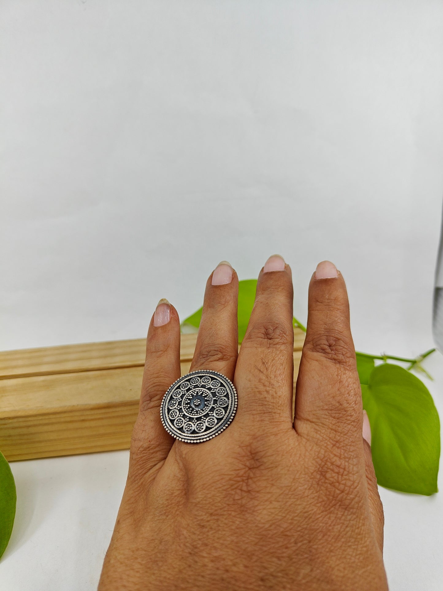 Round silver ring with carvings