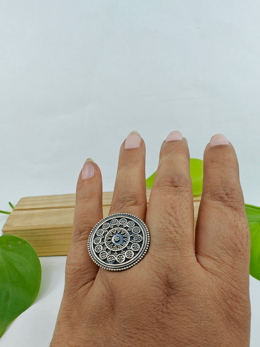 Round silver ring with carvings