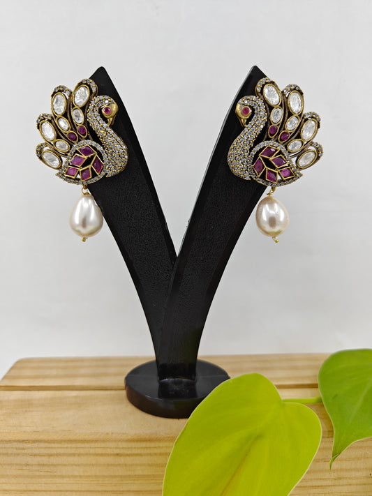 Peacock stud earrings with kundan studded 'feathers' and a pearl drop