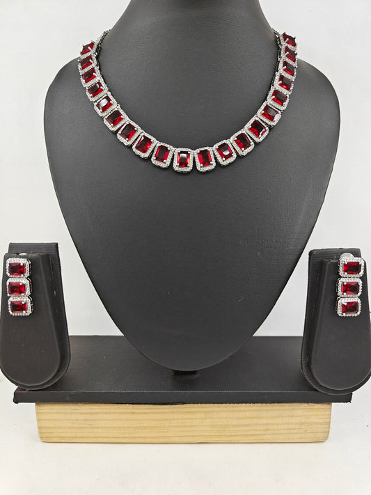 Set in platinum finish with Topaz/ Ruby red rectangular stones,matching earrings