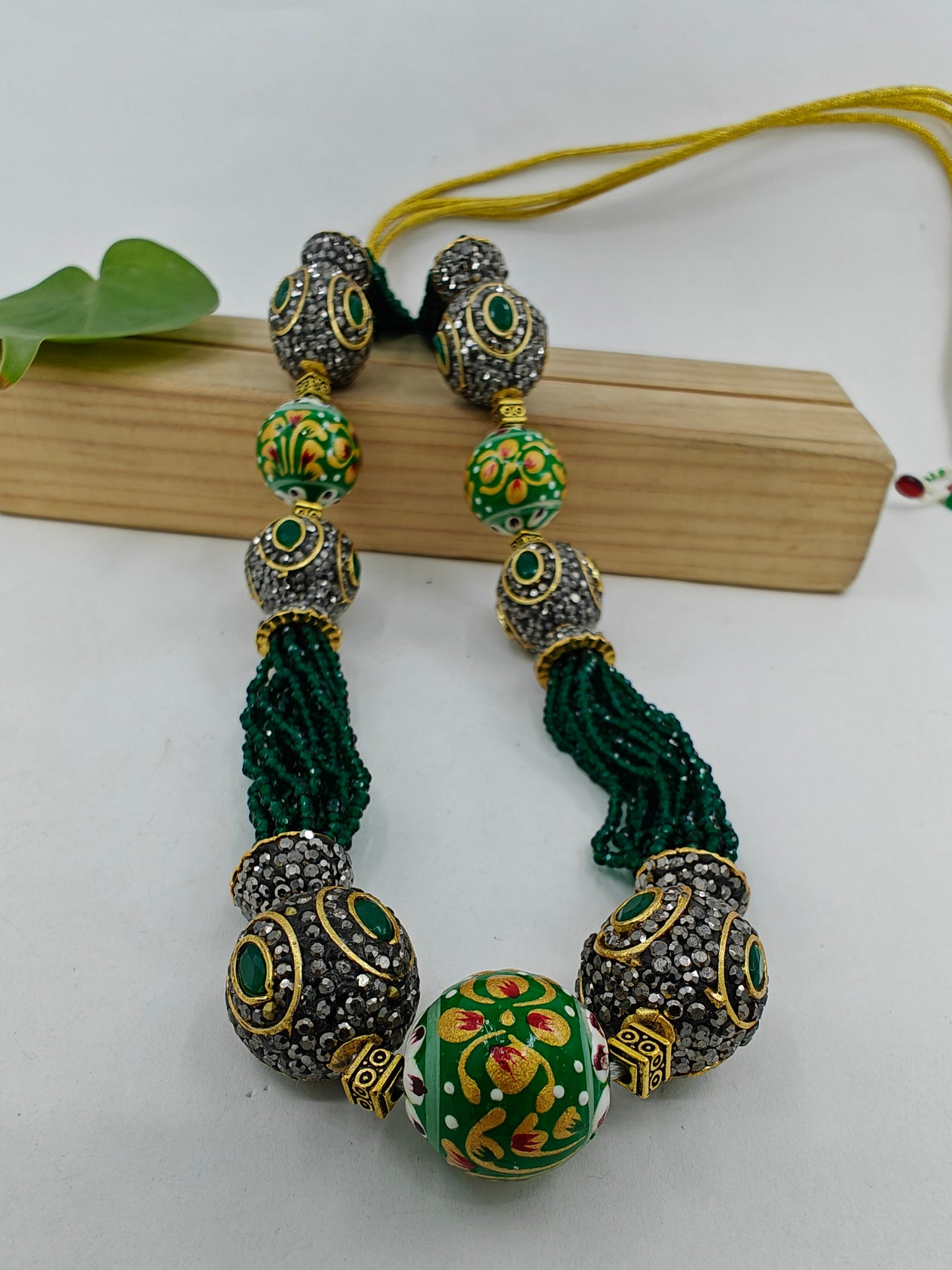 Bead necklace set with painted and worked upon metal beads on green/ blue stone strings