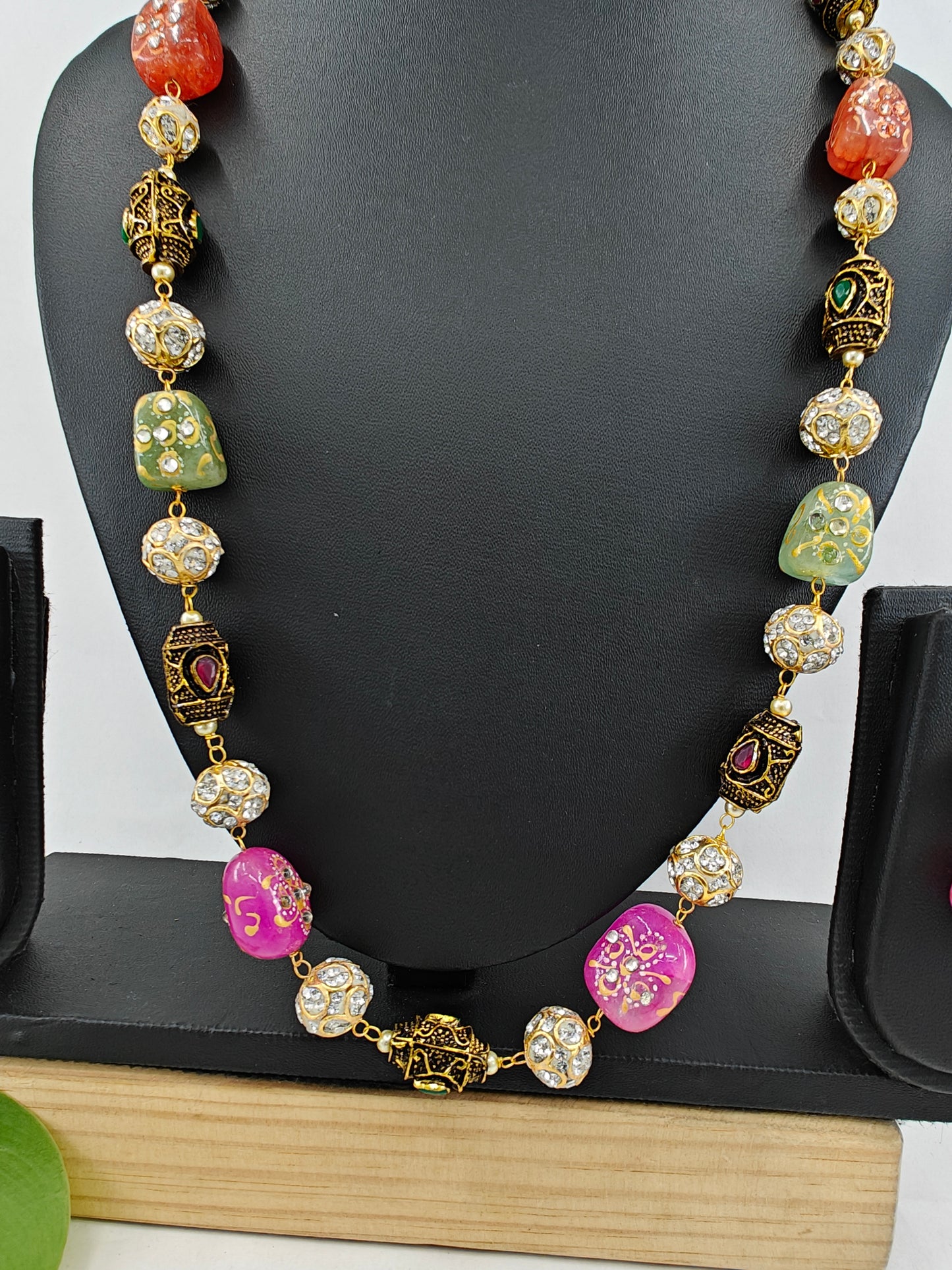 Bead necklace with pink green,orange worked upon beads and metal beads