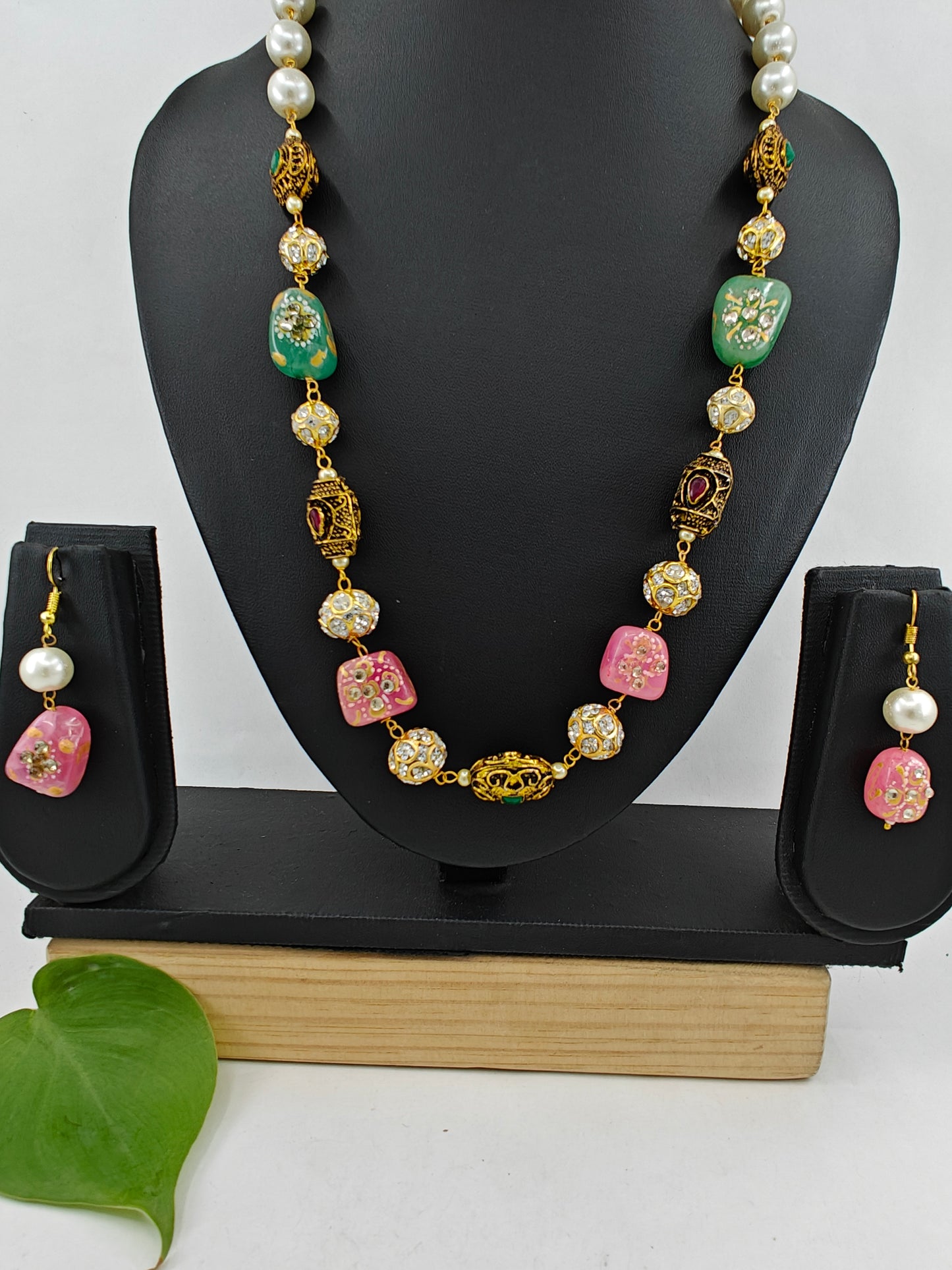 Bead necklace set with pink,green,metal worked upon beads and pearls