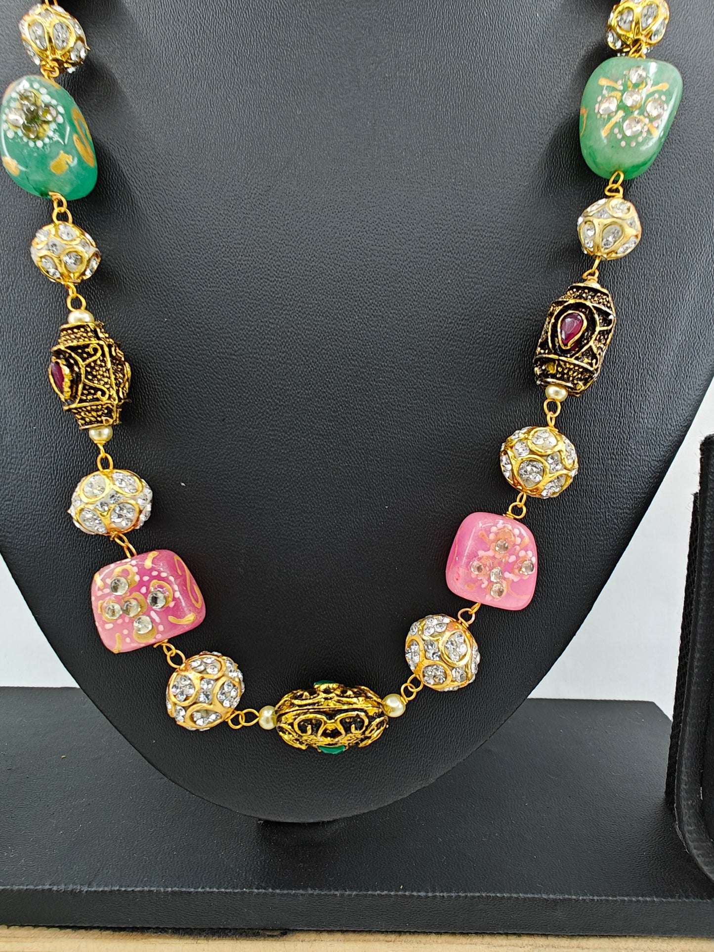 Bead necklace set with pink,green,metal worked upon beads and pearls