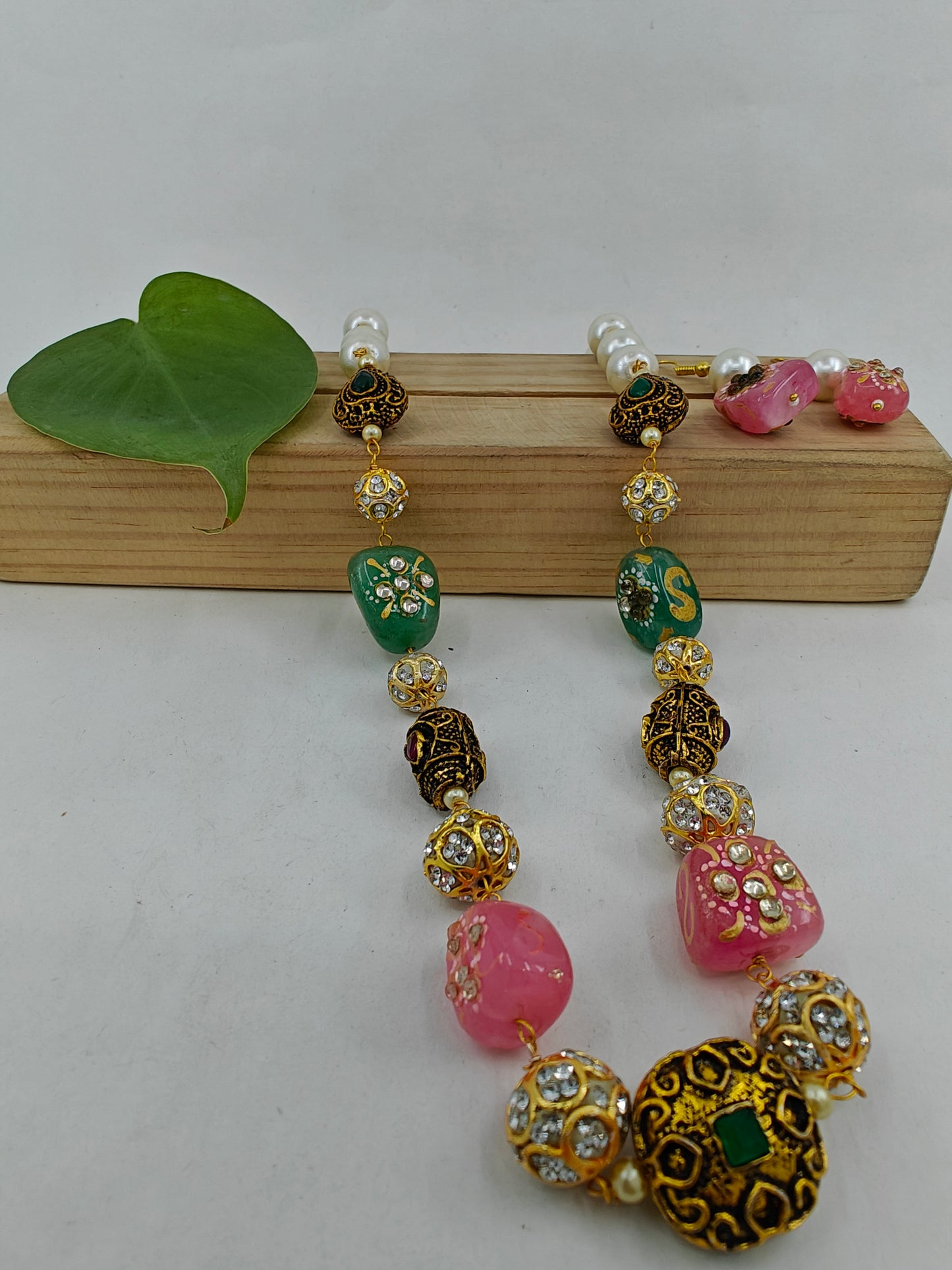 Bead necklace set with pink,green,metal worked upon beads and pearls