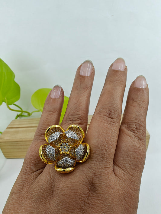 Dual tone ring with an open flower design with silver and gold finish petals