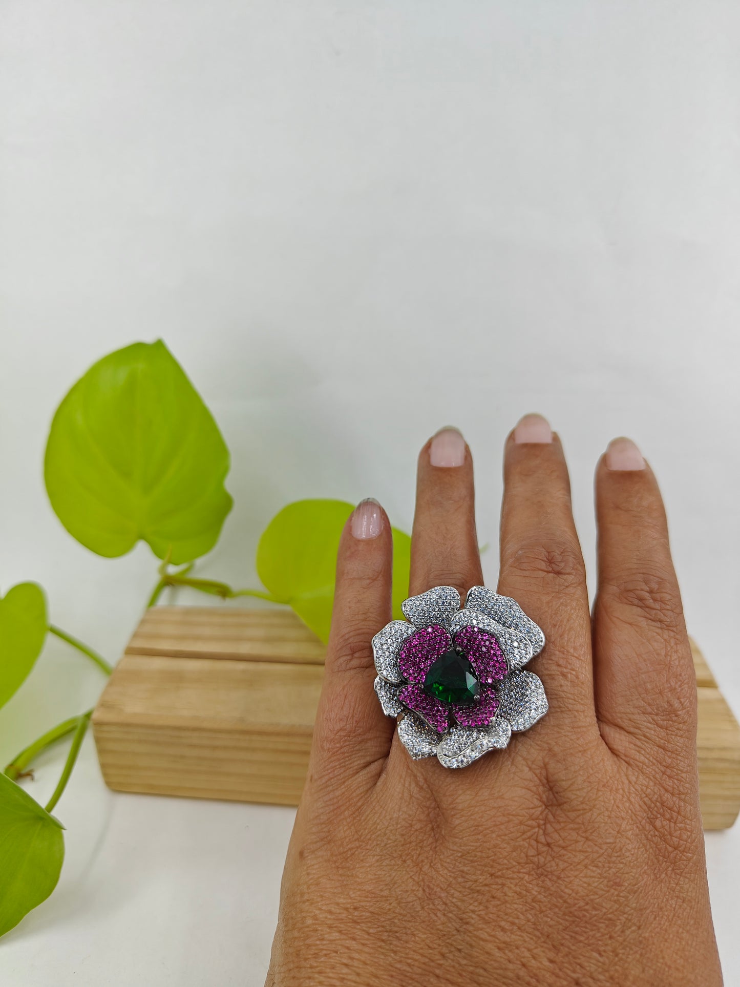 Platinum finish ring with nano stones in amythist and platinum colour in a flower design