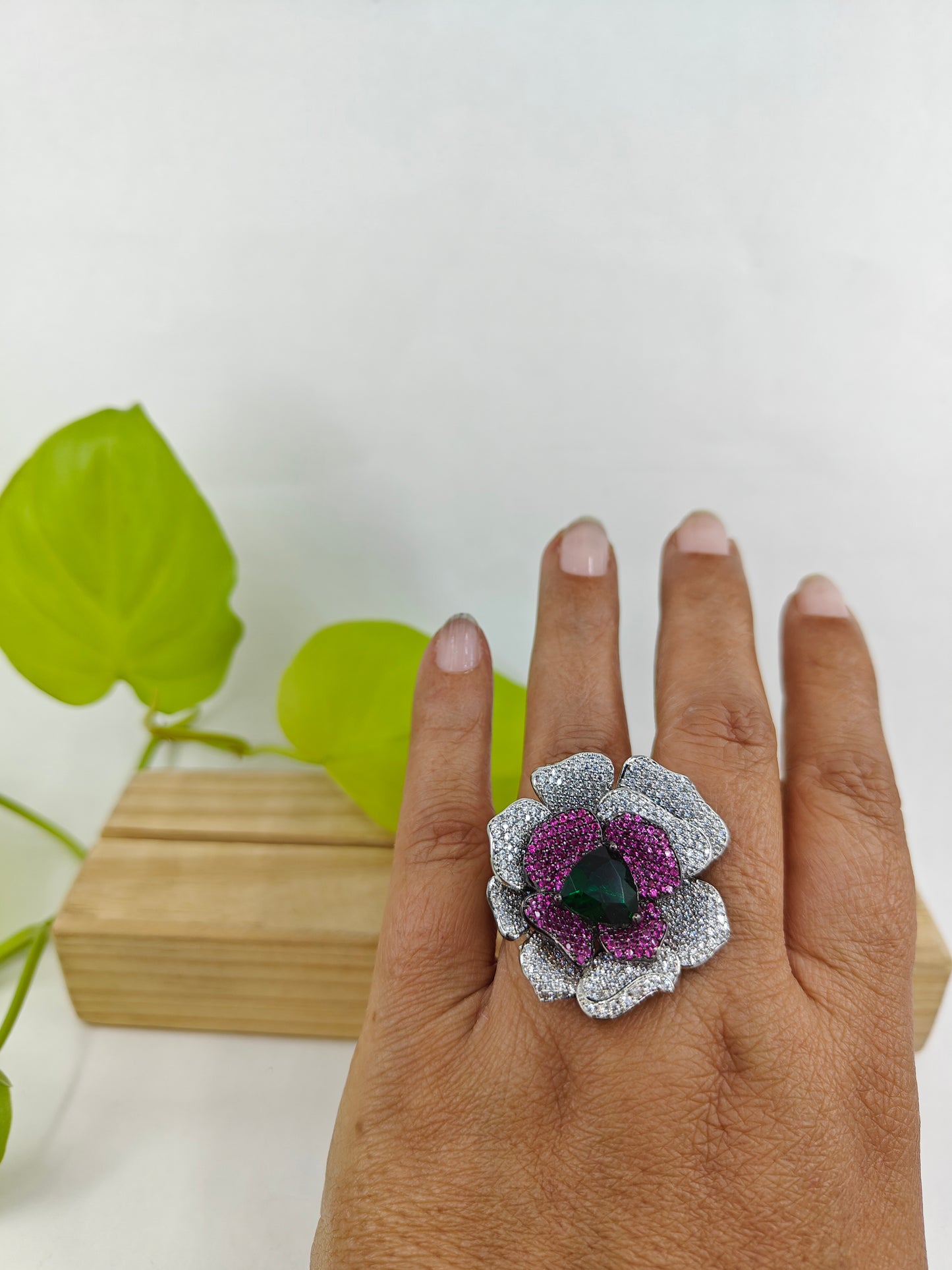 Platinum finish ring with nano stones in amythist and platinum colour in a flower design