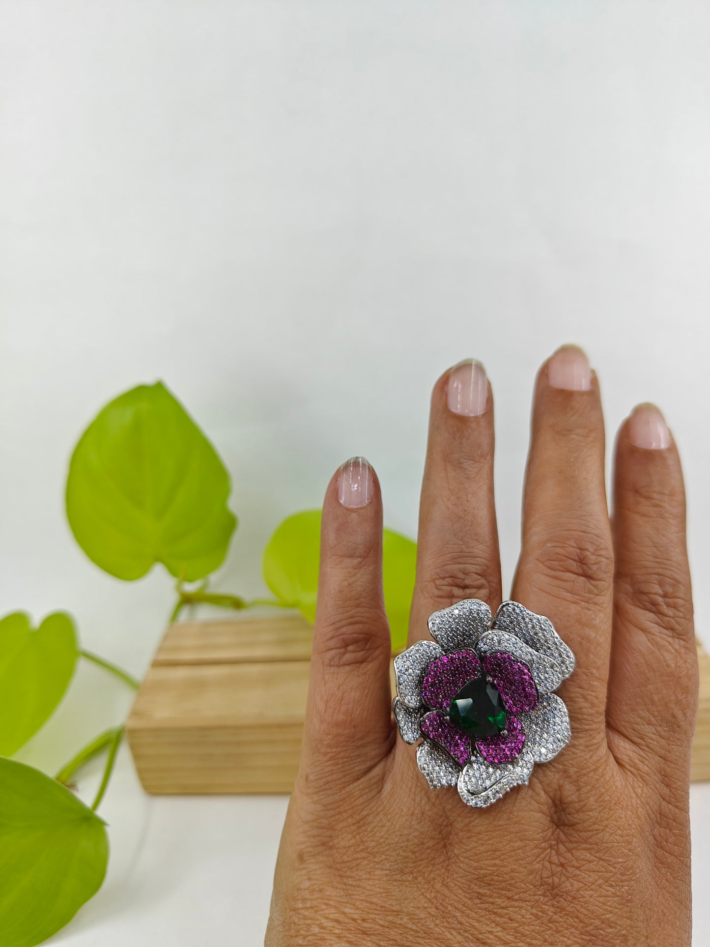 Platinum finish ring with nano stones in amythist and platinum colour in a flower design