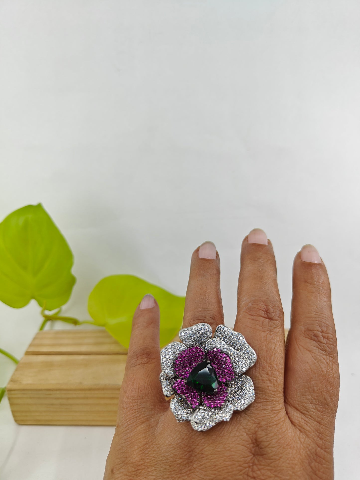 Platinum finish ring with nano stones in amythist and platinum colour in a flower design