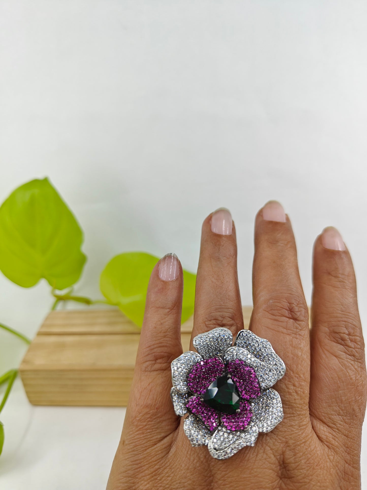 Platinum finish ring with nano stones in amythist and platinum colour in a flower design